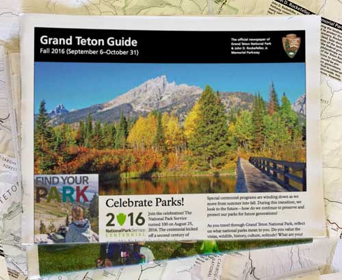 Grand Teton Guide sitting on top of a map Grand Teton Guide sitting on top of a map