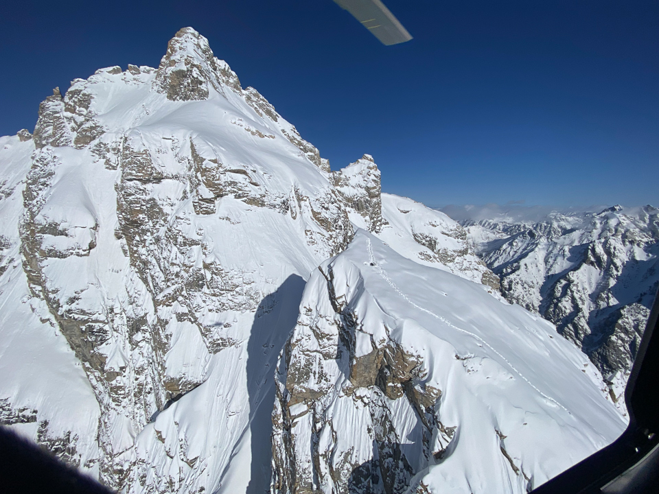 Recon rescue flight captures photo of stranded backcountry skier in the mountains Recon rescue flight captures photo of stranded backcountry skier on East Prong of Mount Owen