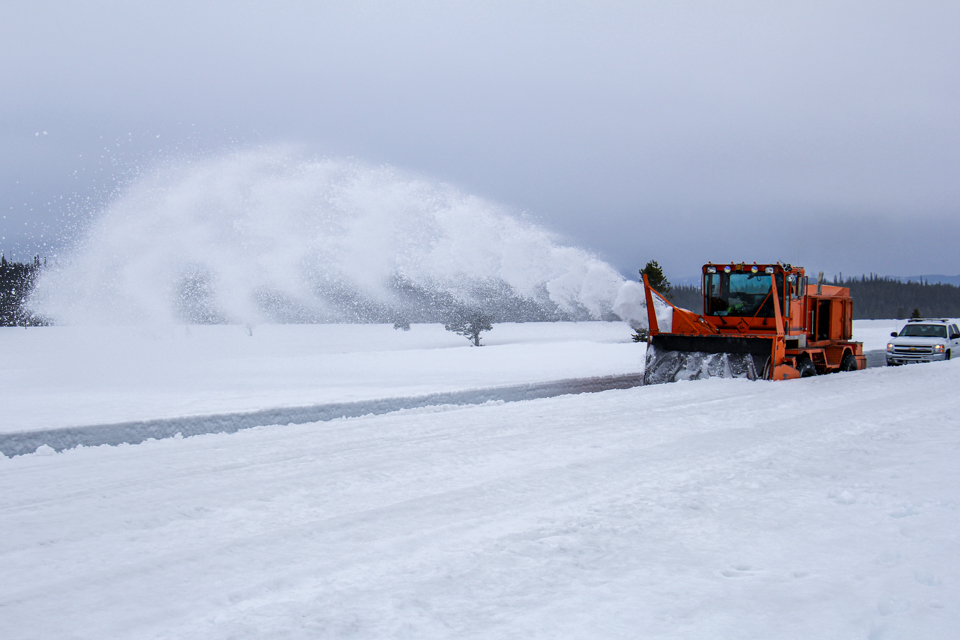 Snow Plowing Teton Park Road Snow plow moving snow off the Teton Park Road