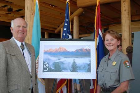 Superintendent Mary Gibson Scott unveils new international postage stamp
with Richard Thomas of the American First Day Cover Society.