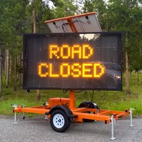 Electronic sign that reads, "ROAD CLOSED"