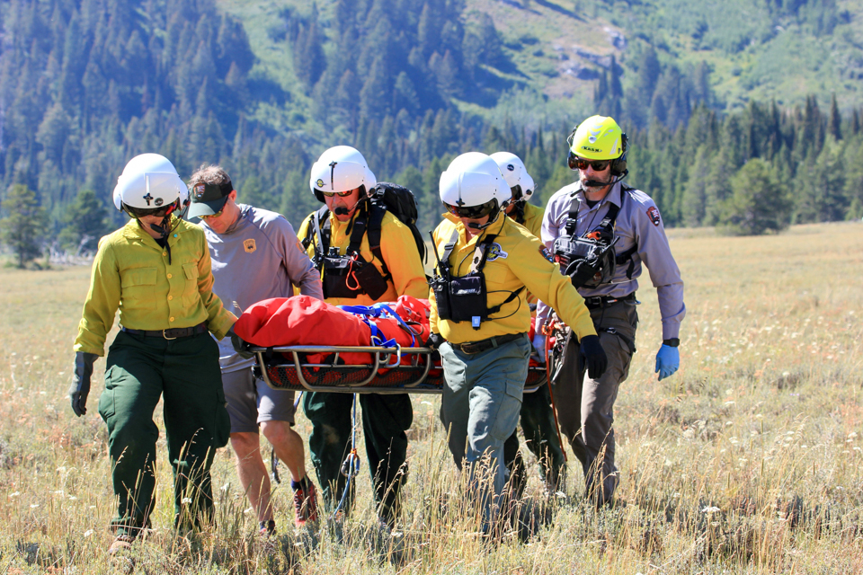 Park rangers lift patient out of the backcountry on a stretcher
