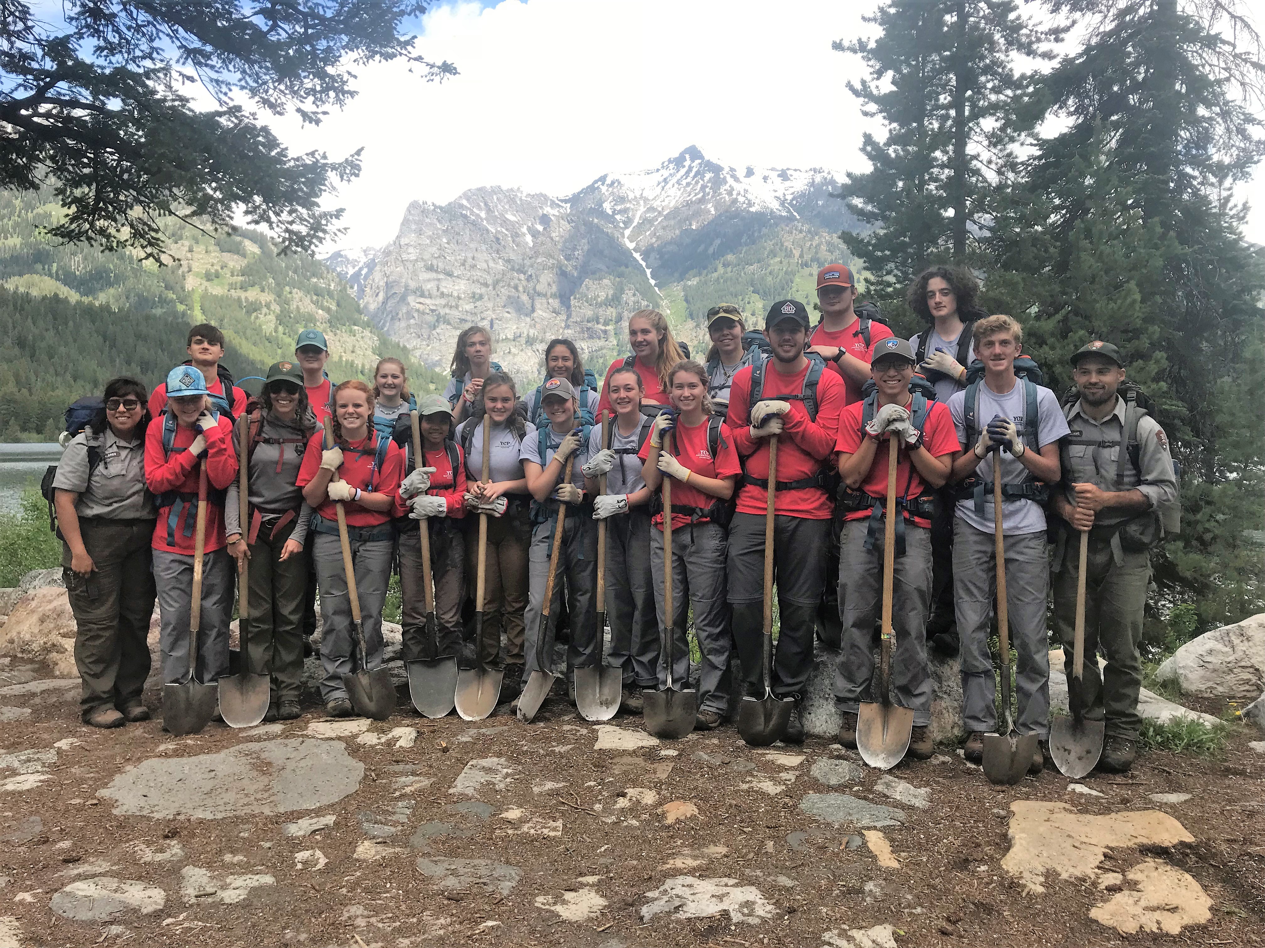 a group of youth with shovel