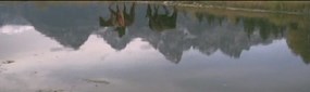 Snapshot of the Video River film, showing reflection of mountain man walking beside the Snake River Snapshot of the Video River film, showing reflection of mountain man walking beside the Snake River