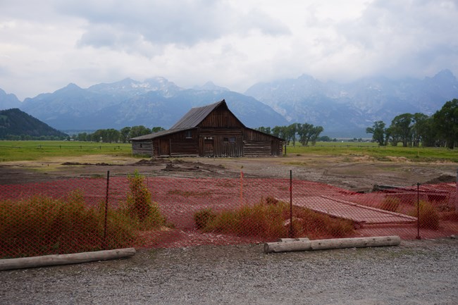 Construction fencing in front of TA Moulton Barn