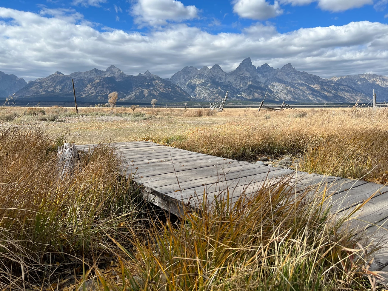 North Mormon Row view 1 footbridge looking west toward Grand Teton range.