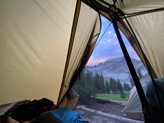 View of the mountains from within a tent