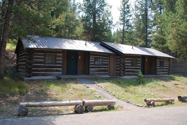 Two log cabins.