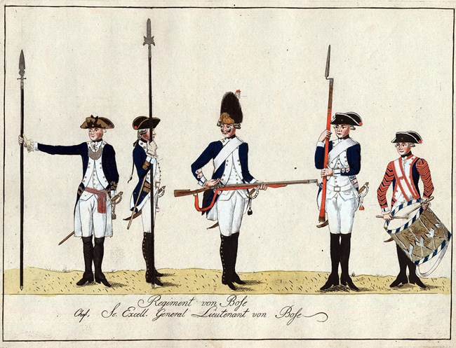 Five Hessian soldiers stand in print, wearing blue coats with white facings, one with bearskin hat, and one is a drummer