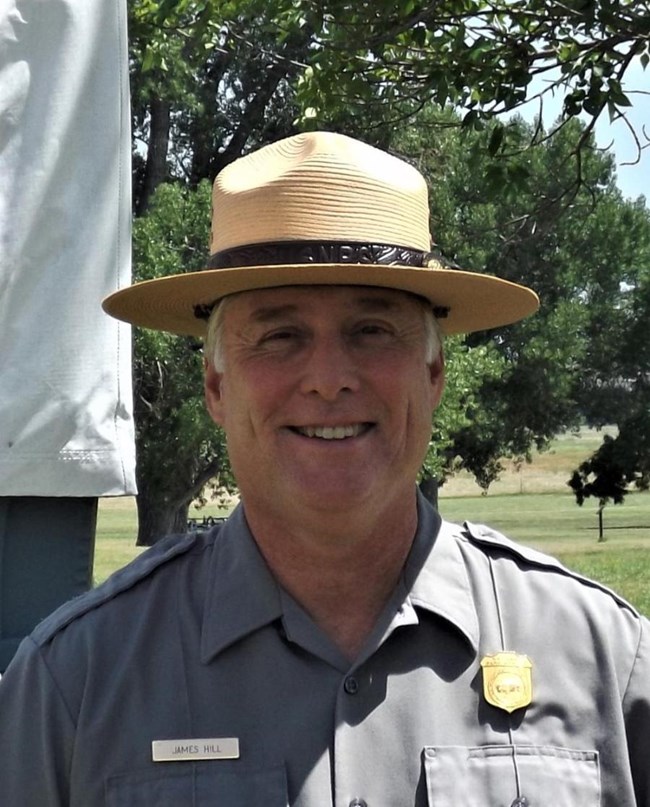 Guilford Courthouse Superintendent James Hill Picture of a smiling, white male, park superintendent wearing park uniform and flat hat