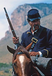 NPS employee portrays a Buffalo Soldier during a living history re-enactment presentation. NPS employee portrays a Buffalo Soldier during a living history re-enactment presentation.