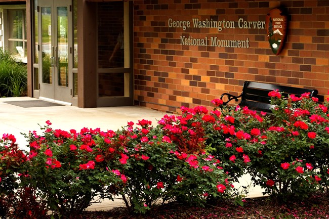 Park visitor center entrance with red roses.