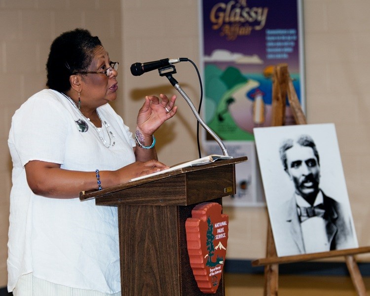 A women speaking at the podium during a Carver Day celebration.