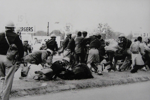 Marchers attacked by Alabama state troopers and local police on the Edmund Pettus Bridge, Bloody Sunday Marchers attacked by Alabama state troopers and local police on the Edmund Pettus Bridge, Bloody Sunday. March, 7 1965.