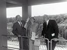 VIPs gaze up at the bells in the carillon