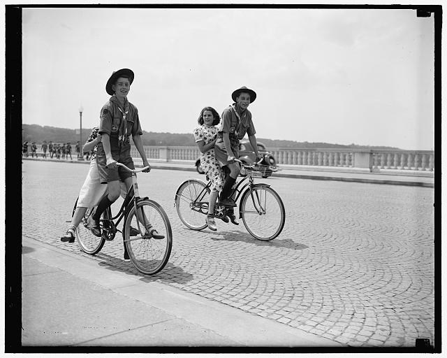 Bicyclists on Arlington Memorial Bridge in 1937. Four people on two bicycles on Arlington Memorial Bridge circa June 30, 1937.