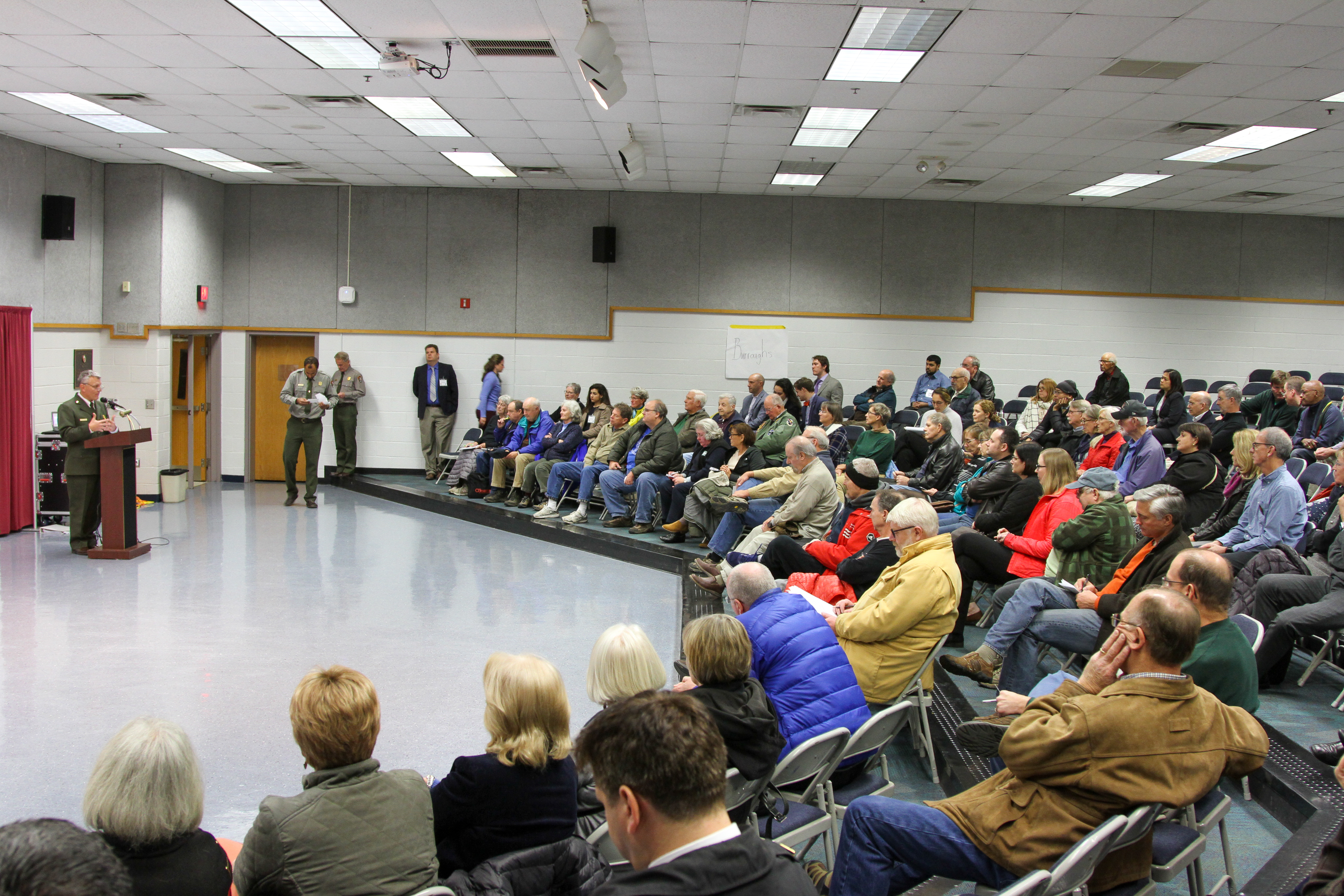 National Park Service staff speak in an auditorium to park neighbors about the southern George Washington Memorial Parkway Safety Study.