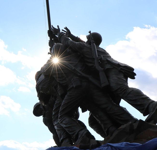 Sunlight beams through the Marine Corps Memorial