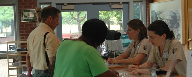interns assist visitors at the park visitor center interns assist visitors at the park visitor center