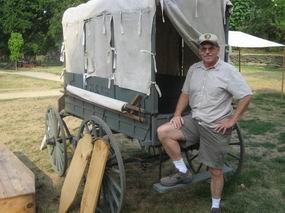Jim Koenig stands in front of the wagon he repaired. Jim Koenig stands in front of the wagon he repaired.