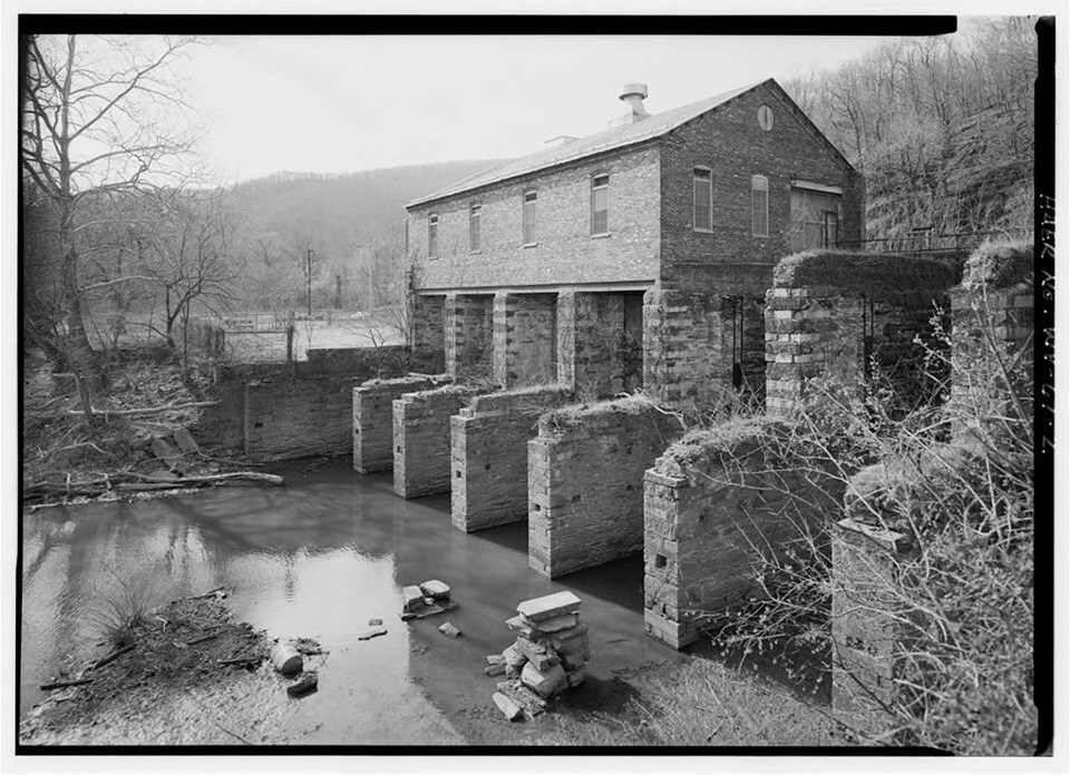 black and white photo of a ruin that was once a hydroelectric power plant