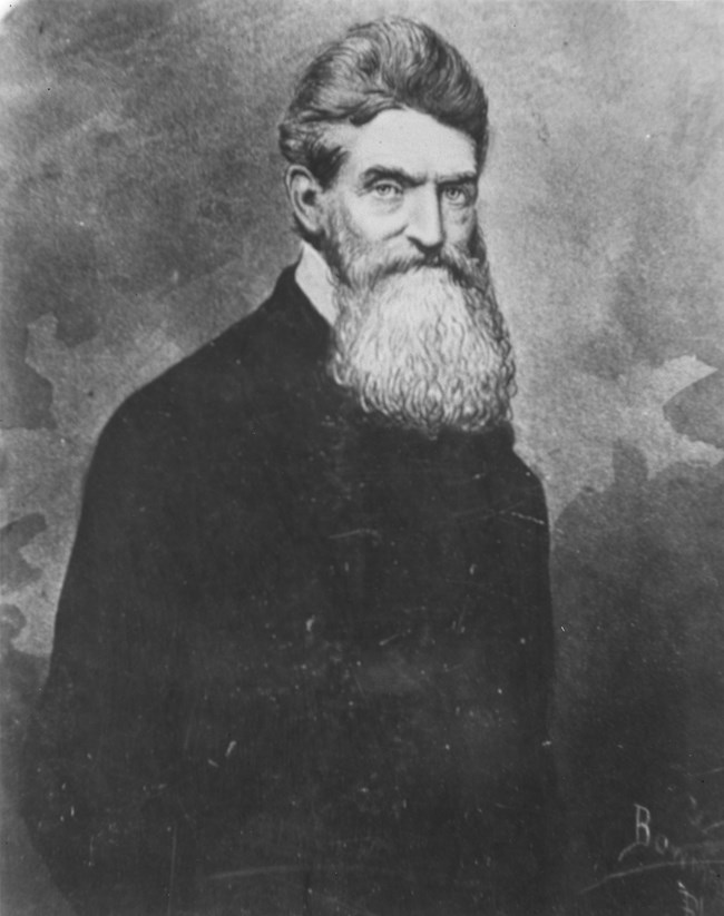 black and white image of John Brown; with a bread and black coat