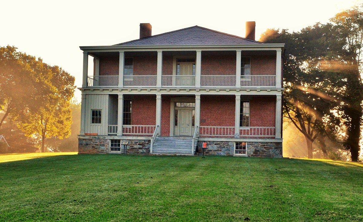 Two story brick structure with double front porches
