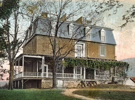 Three-story house with wraparound first-floor porch