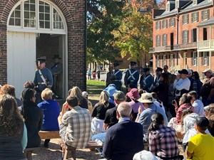 A group of people watches a demonstration by the U.S. Marine Corps Historical Company at Harpers Ferry National Historical Park.