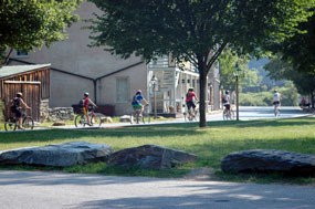 Bikers travel on Shenandoah Street.