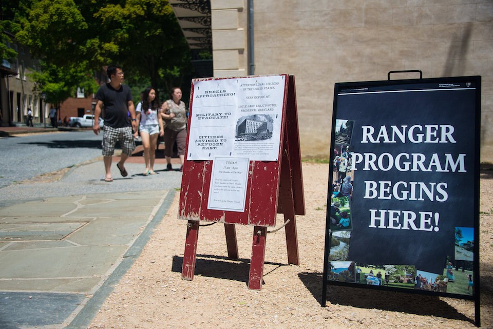 Signs advertising ranger programs in Lower Town