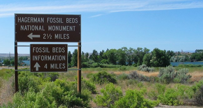 road sign fossil beds right turn fossil information 4 miles ahead