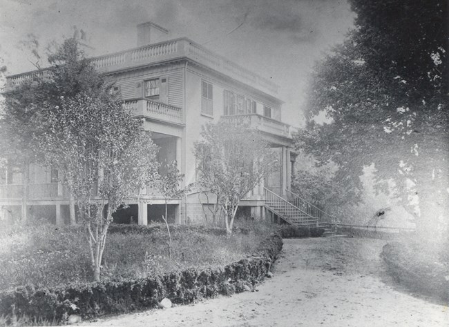 A historical black and white photo of Hamilton Grange.