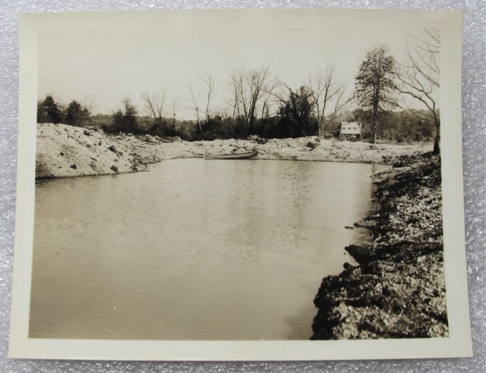 A sepia toned photo of a canal