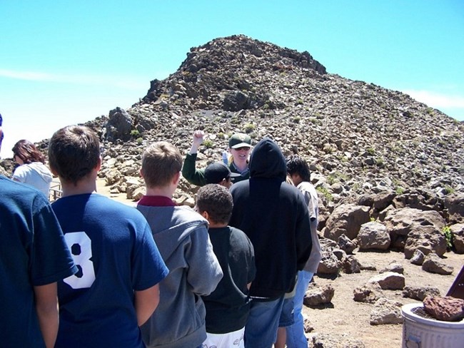 Ranger leading a group of students. Ranger leading a group of students.