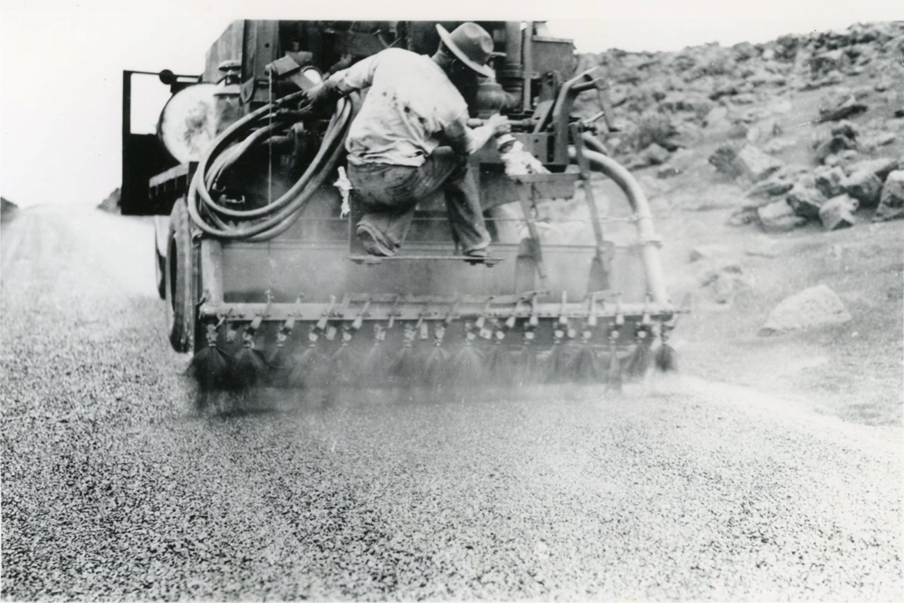 man on the back of an oil truck