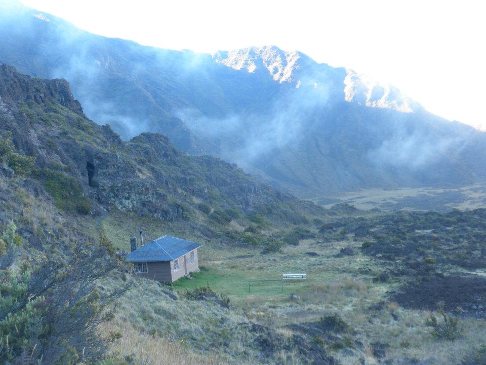 paneled cabin in foggy crater.