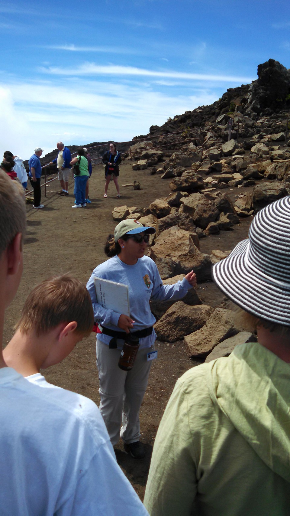 Former Visitor Services volunteer Emily Fernandes leads a walk by the crater overlook, at 9741 feet of elevation.