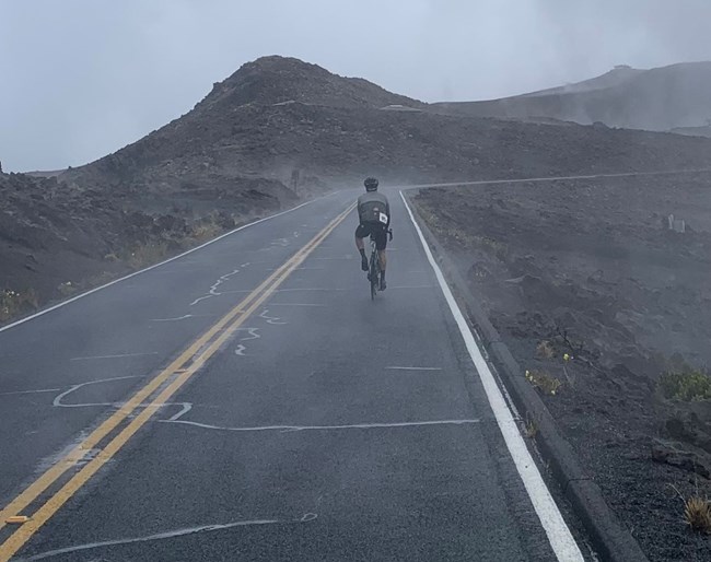 biker on road in foggy conditions