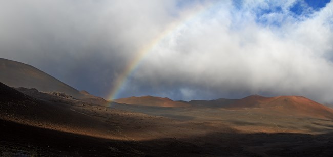 A rainbow appears in the crater. 
