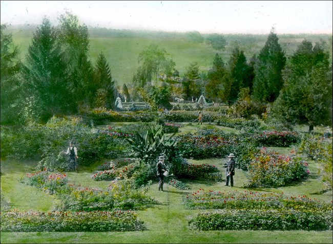 A colorized photograph showing workings in the Hampton gardens in 1879.