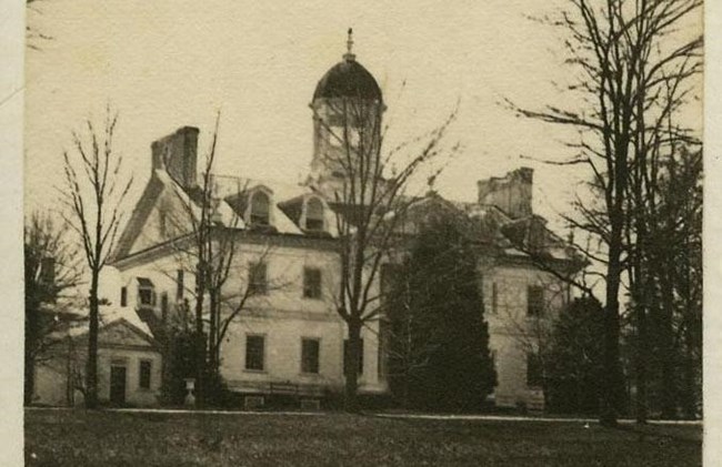 Historic black and white photo of the Hampton mansion.