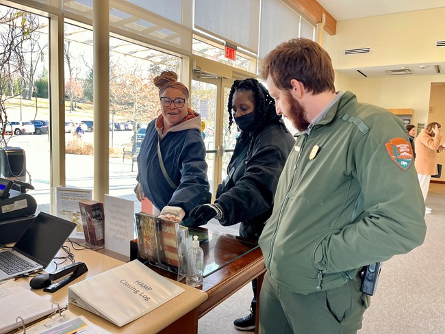 Ranger with Visitors inside the Visitor Center