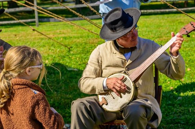 Living historian demonstrates 19th century music.