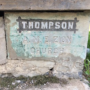 Church cornerstone reads: THOMPSON A.M.E. ZION CHURCH