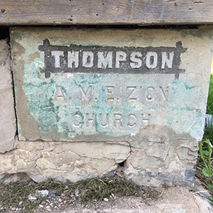 Church cornerstone reads: THOMPSON A.M.E. ZION CHURCH