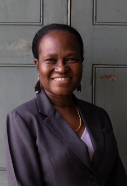 Anne Jonas in a grey suit.