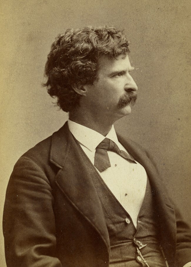 Black and white portrait of a man with a mustache