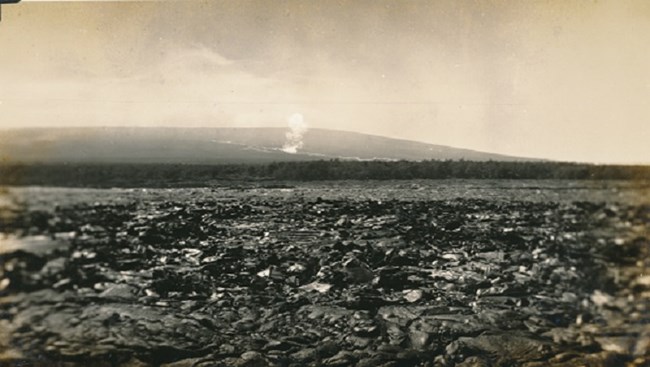 A volcano erupting on its flanks.