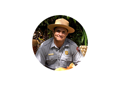 A ranger outside smiling.
